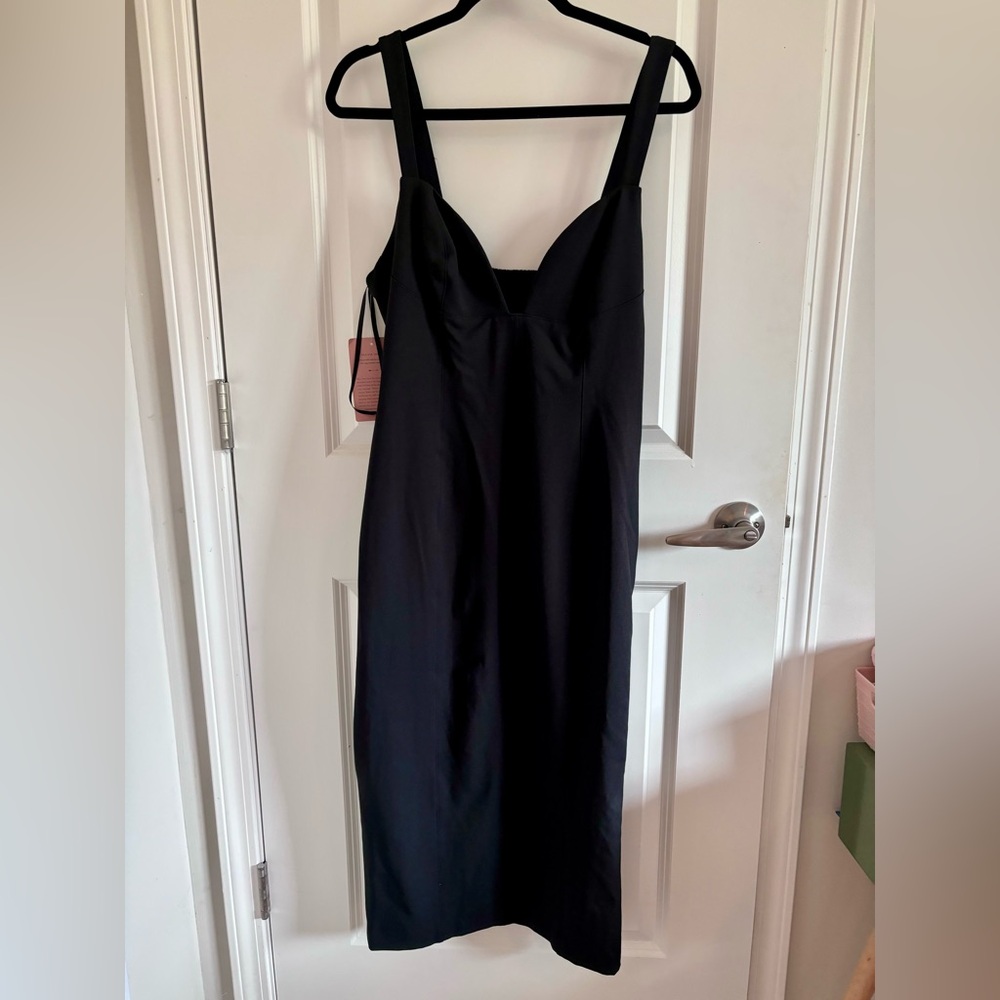 BHLDN Deep v neck dress. Below the knee. Adjustable straps using a button